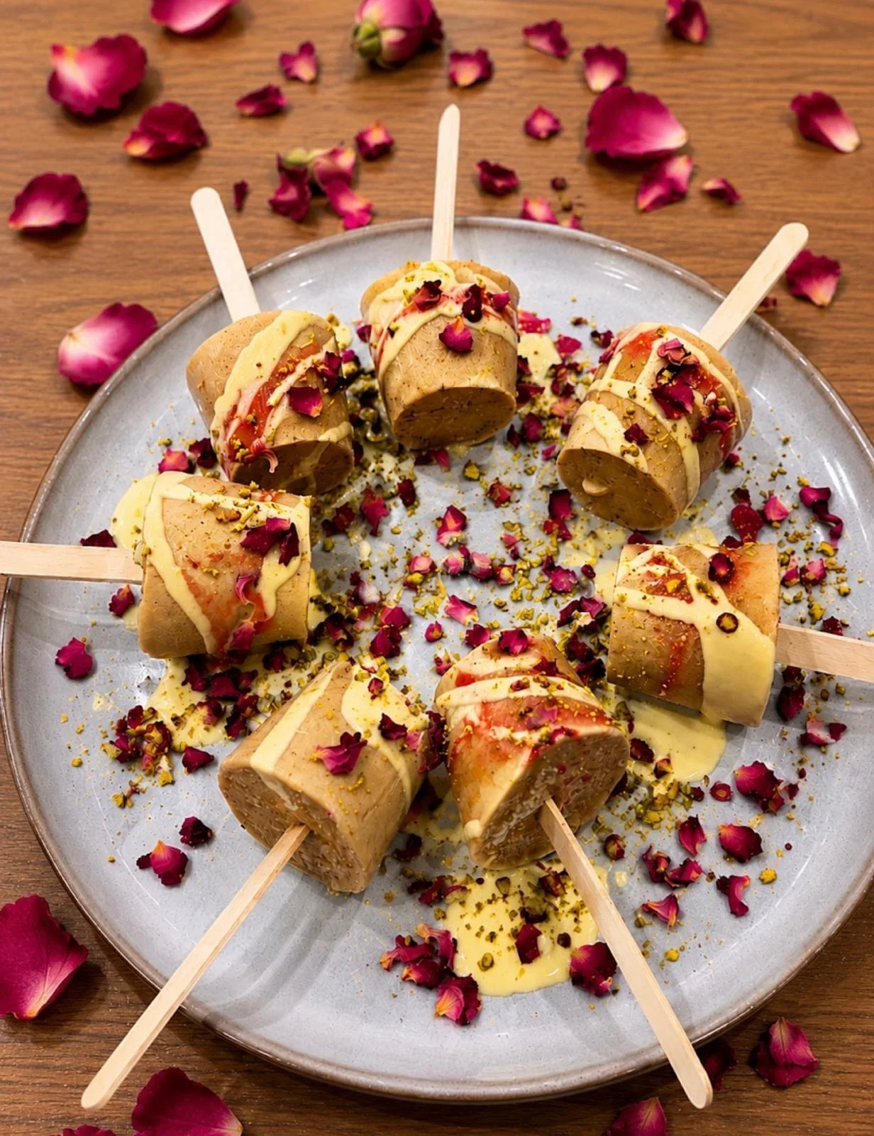 Traditional Kulfi garnished with pistachios and rose petals at Sevana