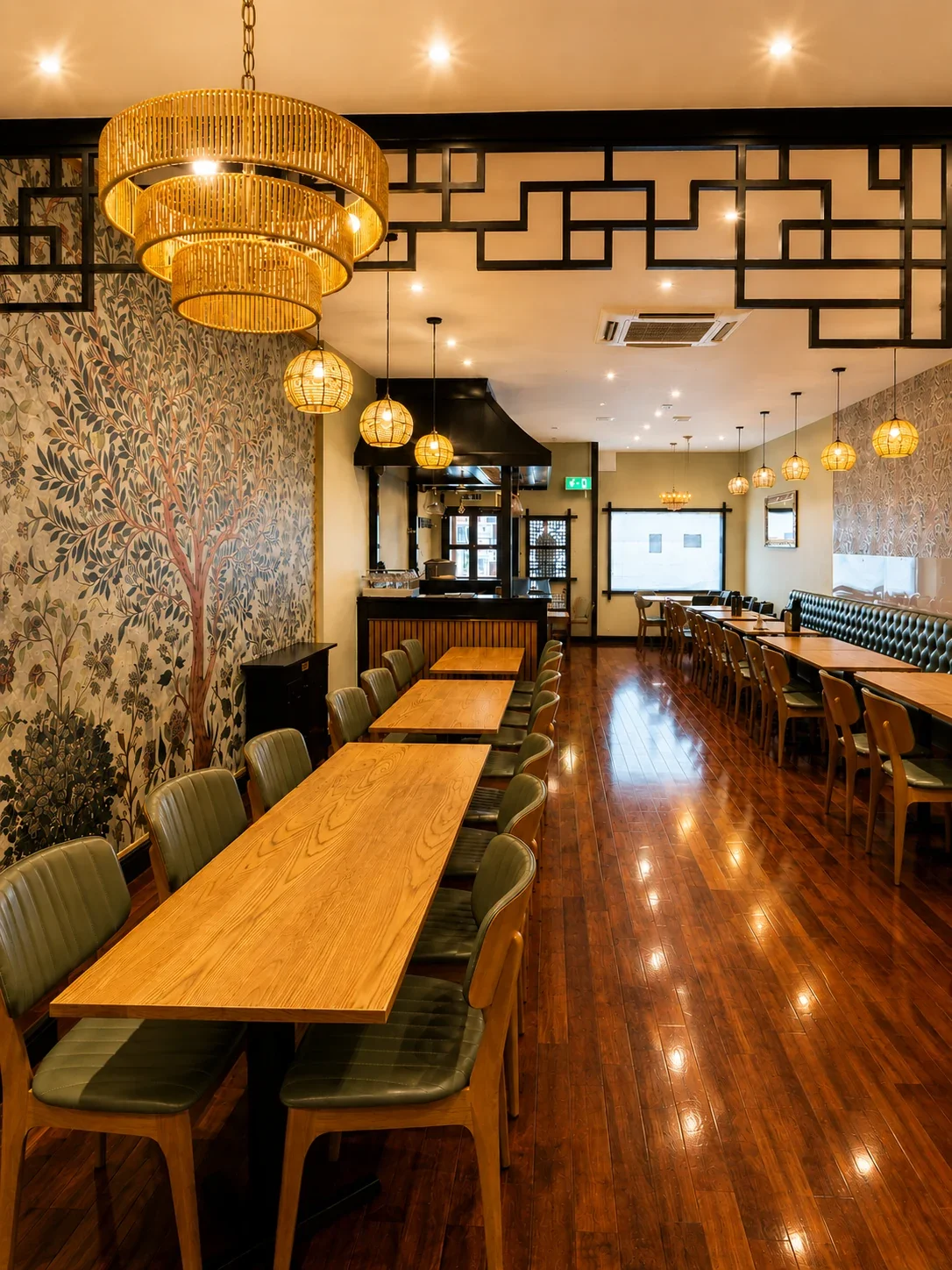 Our dining room with hand-crafted rattan chandeliers and bespoke Tree of Life wall